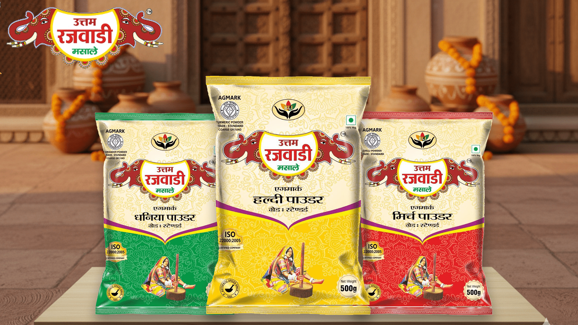 Close-up view of Uttam Rajwadi Turmeric (Haldi), Coriander (Dhania), and Chili (Mirch) powder packets showing Agmark certification and elephant logo.
